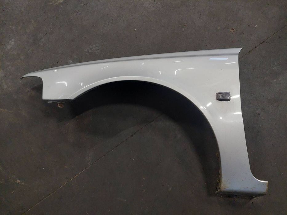 BŁOTNIK LEWY PRZÓD VOLVO V40 I S40 I LIFT 329-52