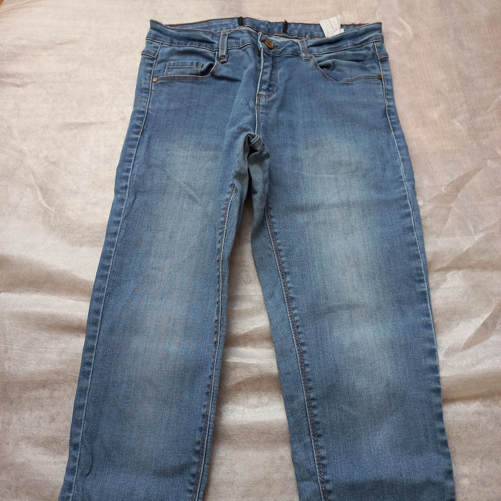 Spodnie damskie jeansowe cropp