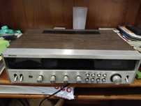 Recetor estéreo FM/AM, especificamente um modelo "Rising FM/AM Stereo