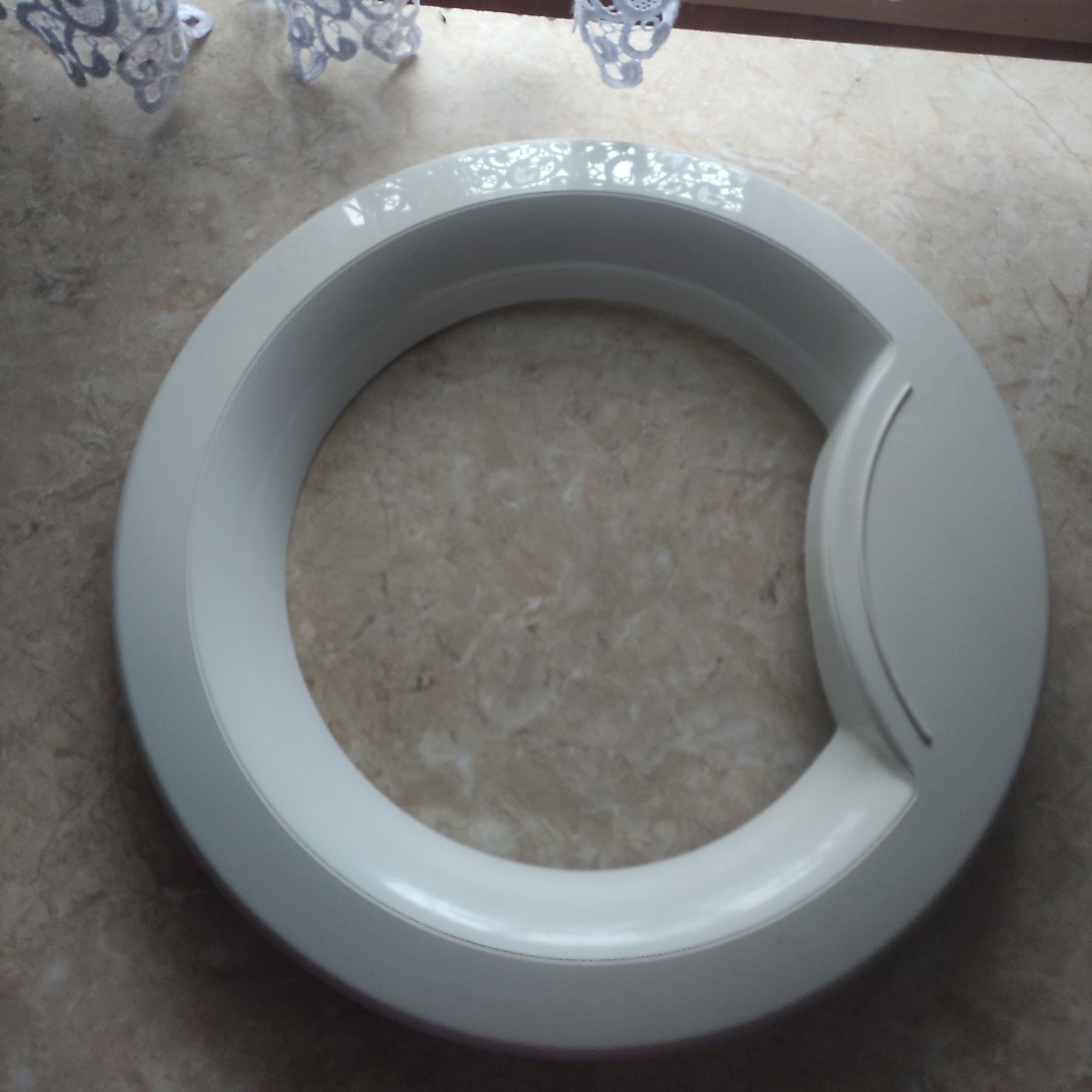 Drzwiczki do pralki Whirlpool.