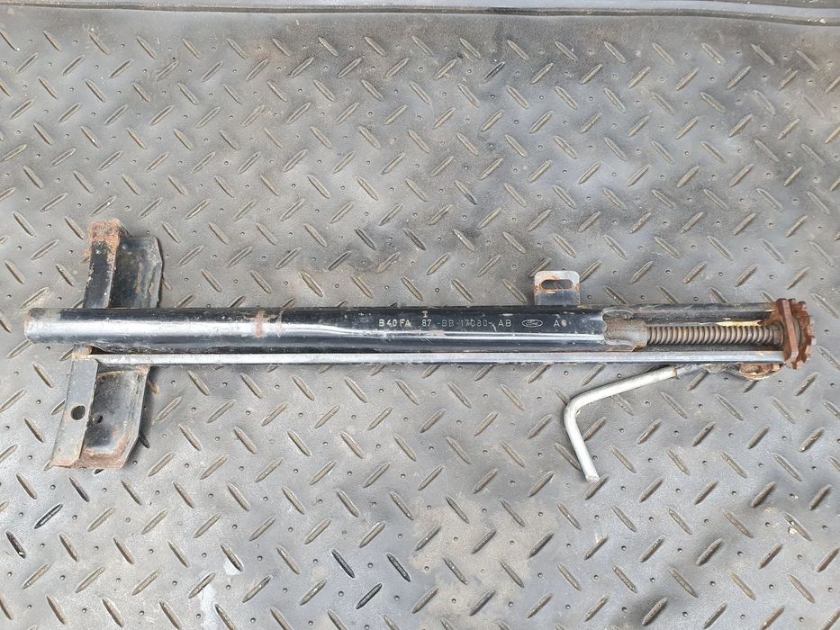 FORD SIERRA PODNOŚNIK SAMOCHODOWY LEWAREK 87BB-17080-AB ORYGINAŁ