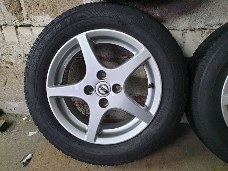 Felgi alu Nissan R15 4x100 opony zimowe 185/65R15 5,8mm Semperit
