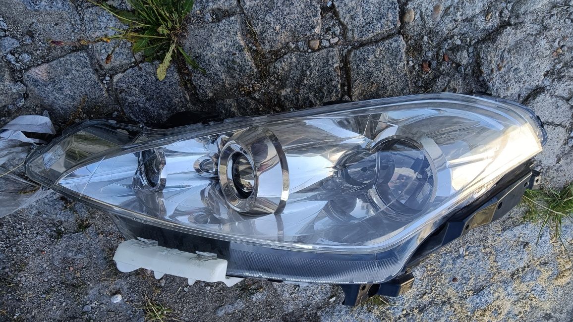 Farol ótica Peugeot 4007 óptica 2009 esquerda