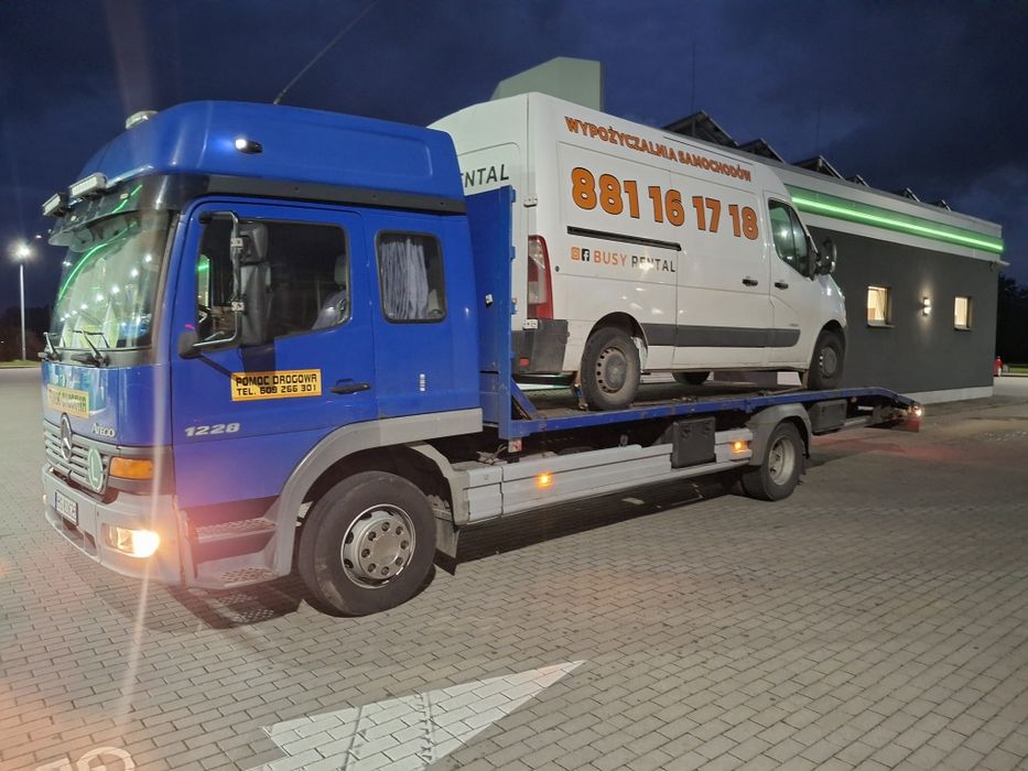 Laweta transport pomoc drogowa koparka ładowarka wozek widłowy bus