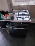 Kuchenka gazowa z piekarnikiem elektrycznym 60cm Srebrna INOX stan bdb