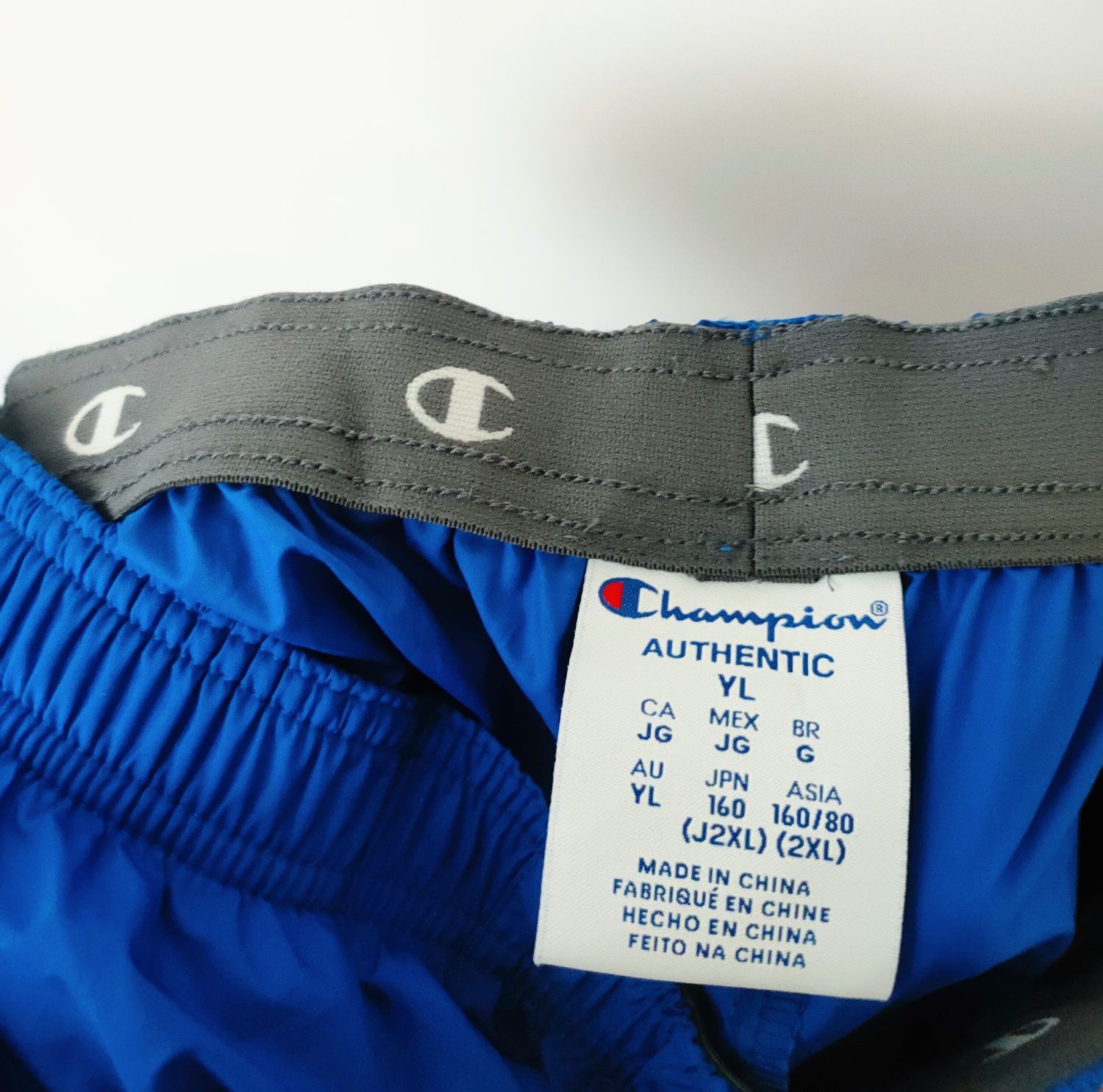 Nowe Spodnie dresowe Champion unisex S
