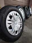 Felgi stalowe 17" z kołpakami AUDI i oponami BRIDGESTONE 6.5JX17H2