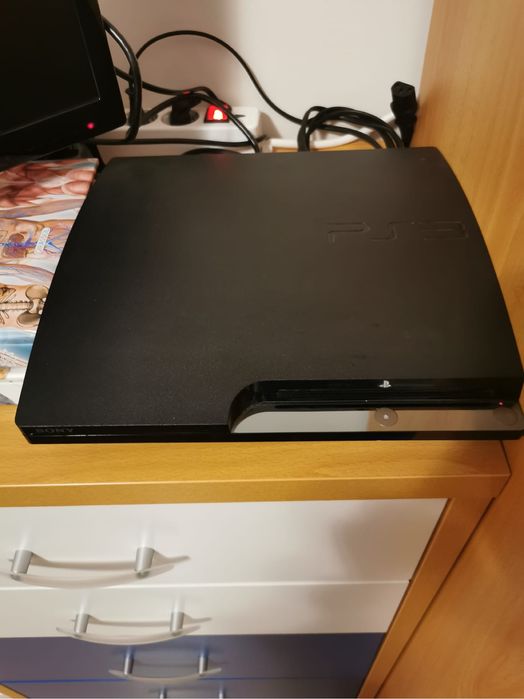 PlayStation 3 com jogos e comando