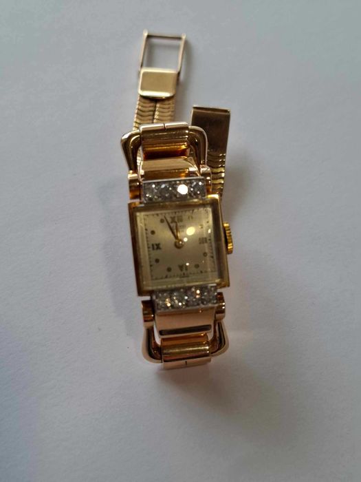 Relógio de corda todo em ouro e diamantes