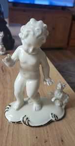Figurka porcelanowa Chłopiec ze Szczeniakiem