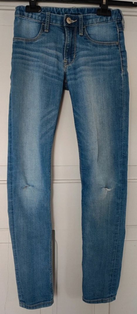 Spodnie jeansy jasne dziury na kolanach skinny H&M r.140 9-10 lat