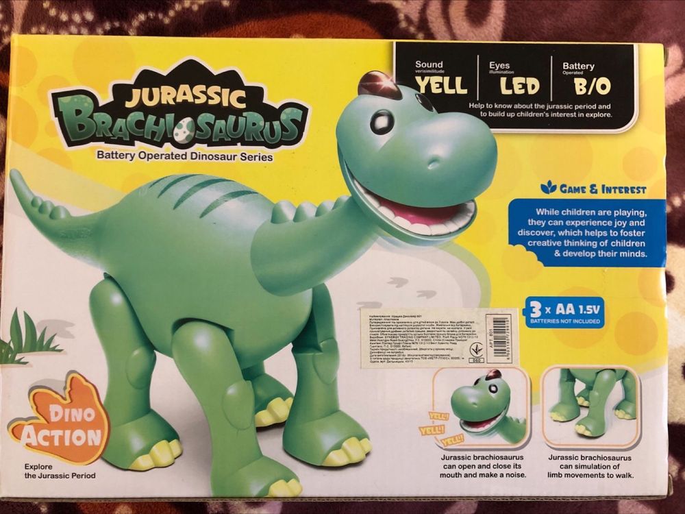 Музыкальная игрушка Динозавр, сам ходит, на батарейках.