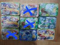 3 metalowe puszki z kartami pokemon