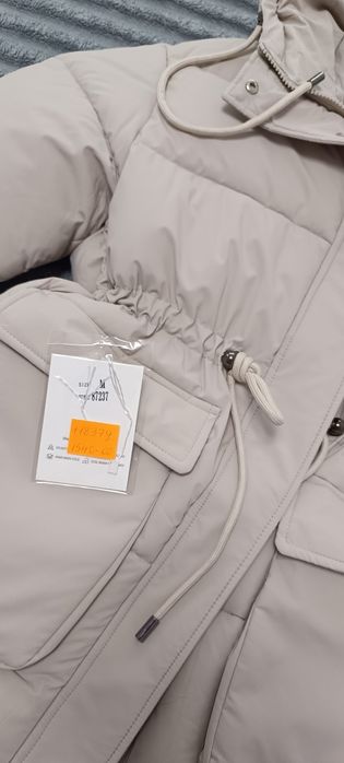 Зимова куртка на затяжках