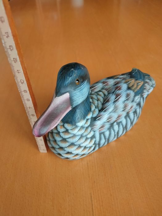 Conjunto de patos em madeira.