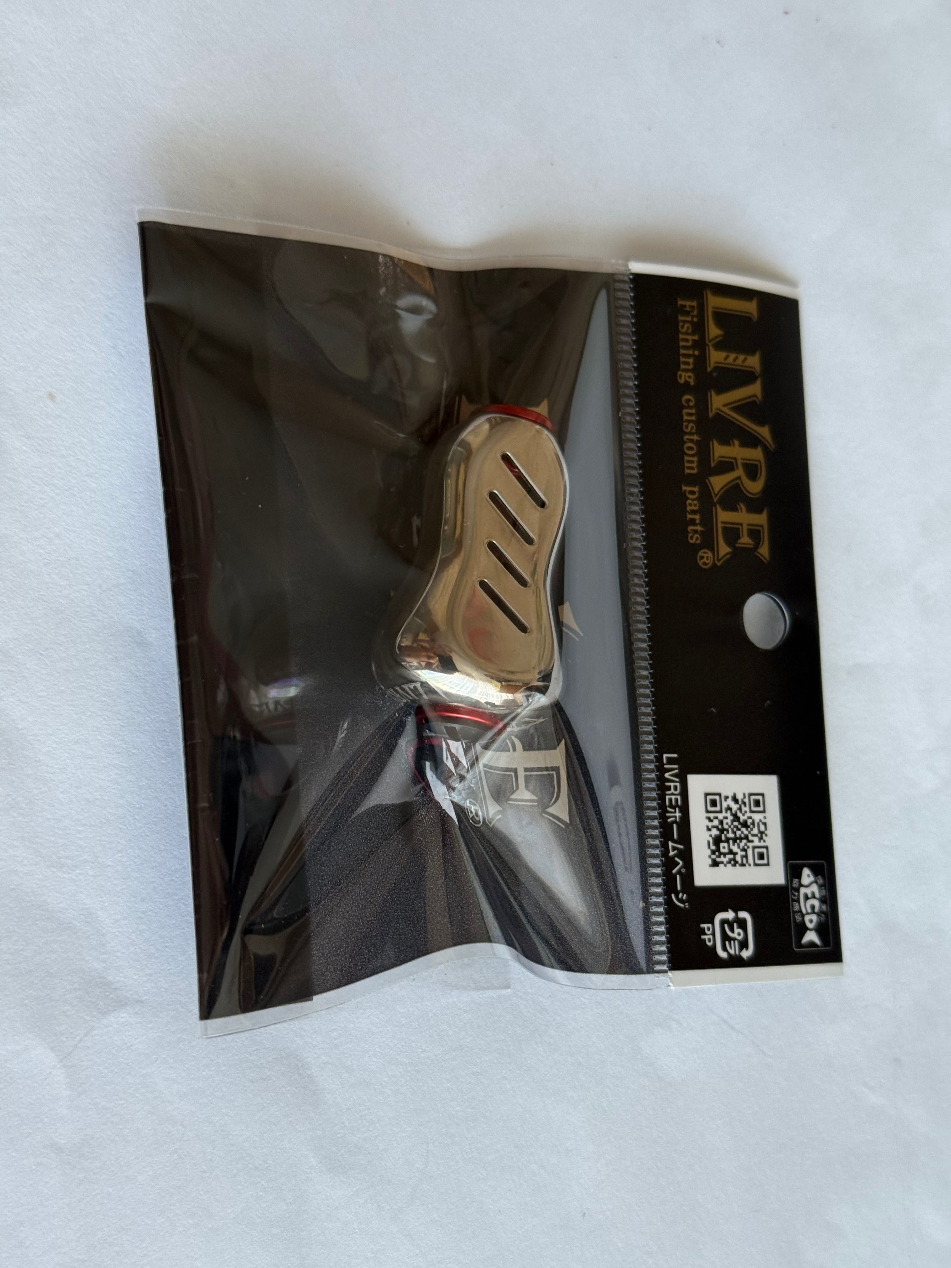NOWY-Knob LIVRE FINO PLUS Titanium do wszystkich koł. Shimano i Daiwa