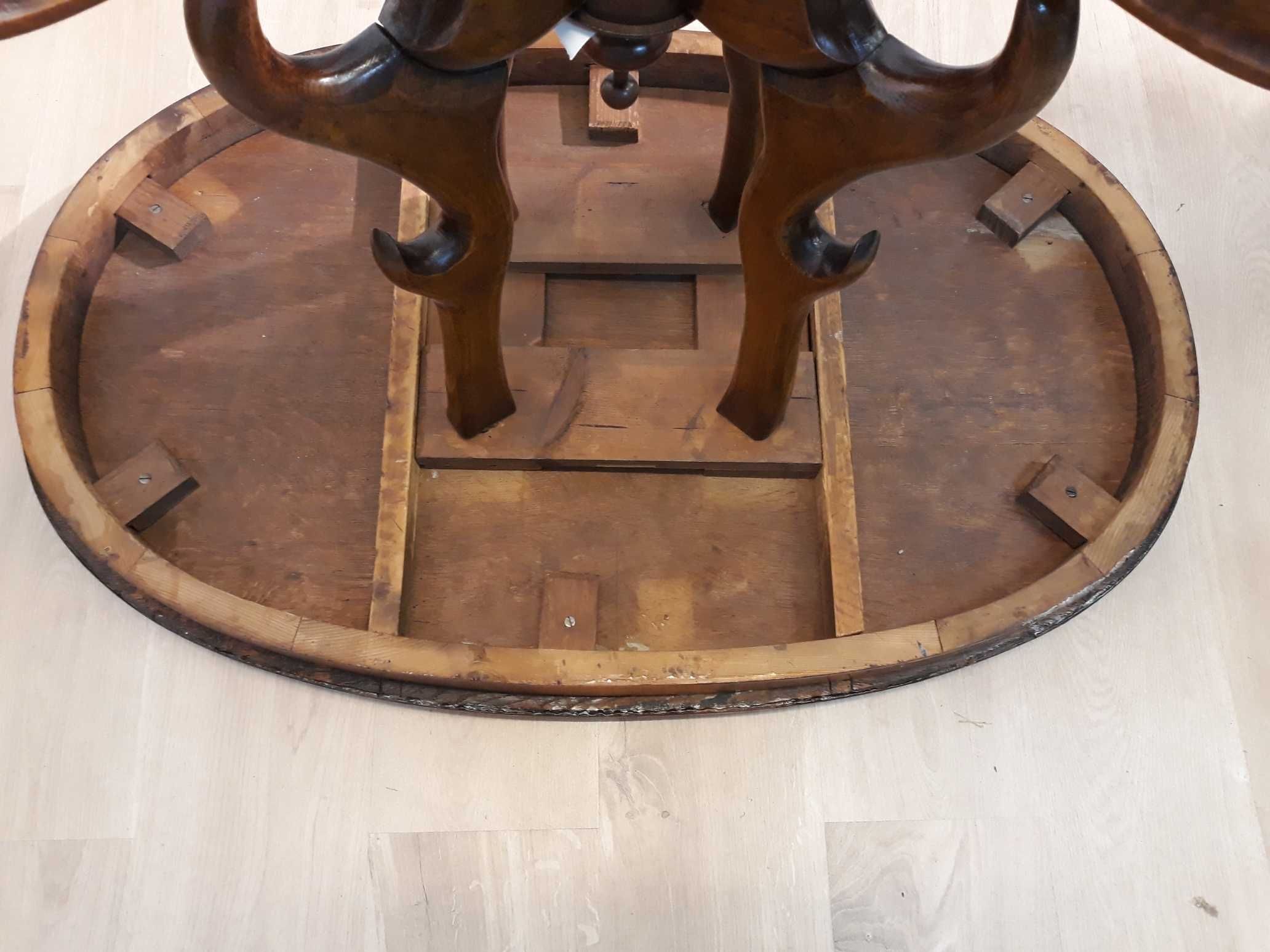 Zabytkowy stół drewniany owalny intarsjowany blat, rzeźbione nogi