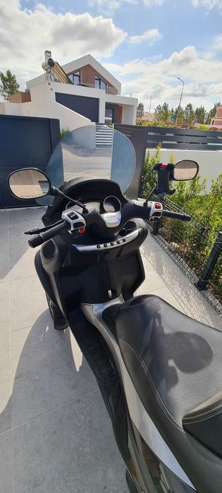 mp3 500. apenas 23817kms com revisao. de garagem estimada. CARTA B