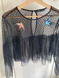 Blusa semitransparente