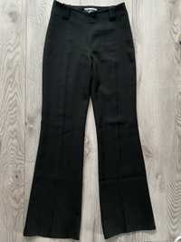 eleganckie czarne spodnie dzwony z szerszymi nogawkami