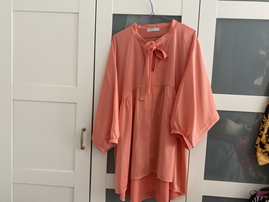 Tunica com um laco com maga tipo balao com cos