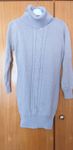 Camisola de senhora bege.