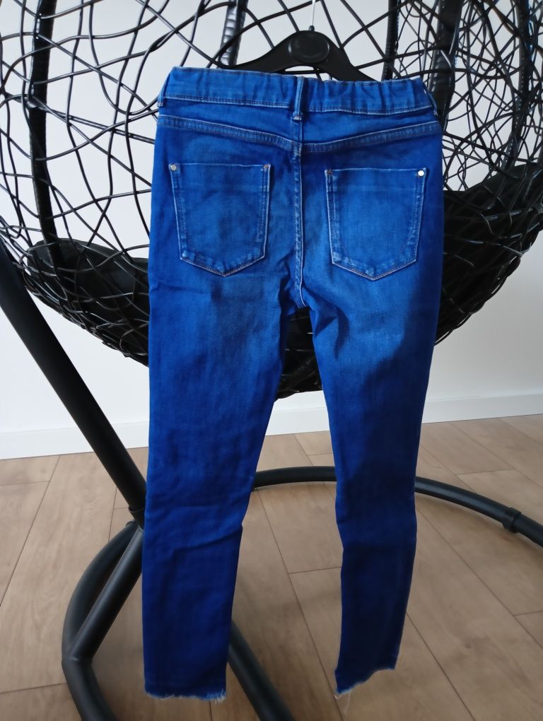 Spodnie River Island rurki miękki jeans z dziurami rozm. 134 9 lat