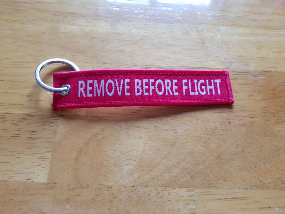 Porta chaves remove before flight