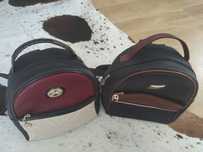 Mochilas cavalinho preta com beje e vermelho ou preta com castanho.