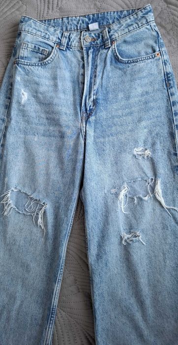 Spodnie jeansowe dzwony z dziurami, wąska talia, H&M rozm. 34