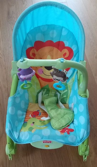 Bujaczek Fisher price z wibracją lew grzechotki
