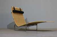 Poltrona Poul Kjaerholm modelo PK24 para Fritz Hansen