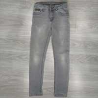 Sprzedam jeans szare r.140