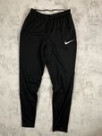 Чорні спортивні штани Nike Dri-Fit з білим свушем – комфорт і стиль