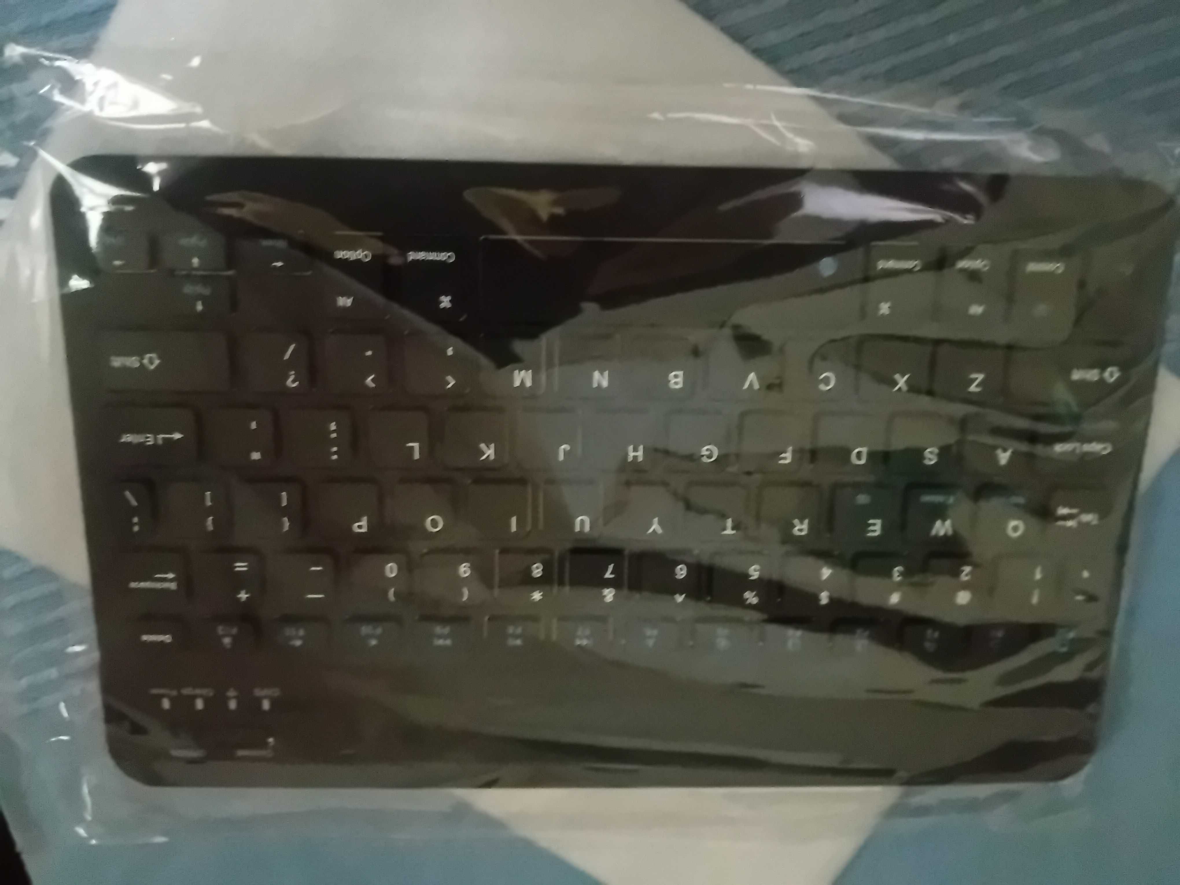 teclado sem fios Wuxian ideal p tablets e auriculares t da mesma marca