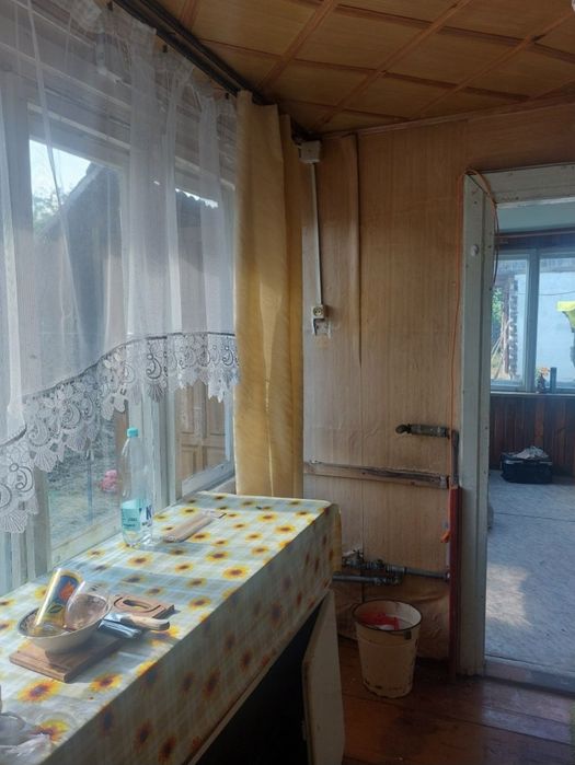 Dom drewniany z murowaną przybudowka.