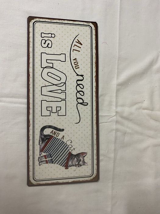 Placa alusiva a gatos