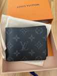 Składana męska portmonetka Louis Vuitton w stylu vintage