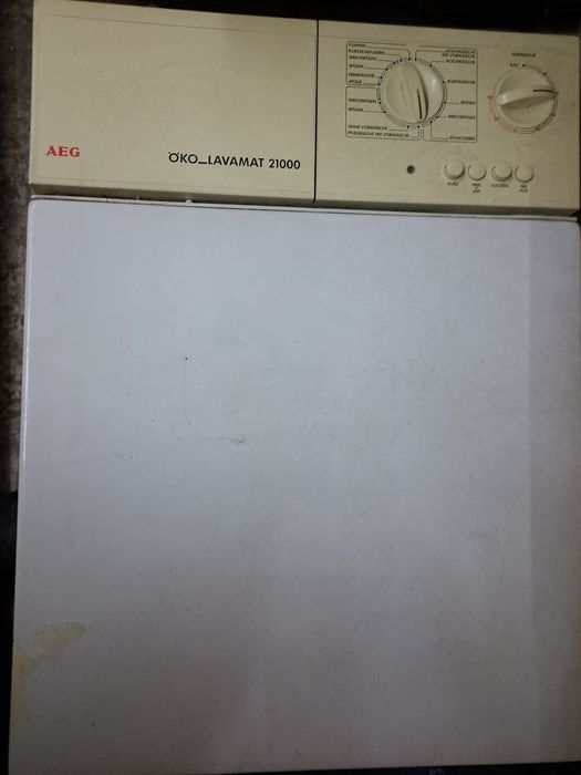 Пральна машинка вертикального завантаження