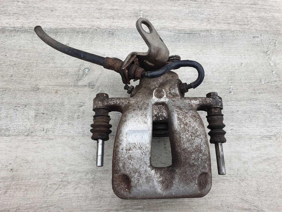 Skoda Octavia II Audi A3 8P Touran Zacisk hamulcowy tył prawy