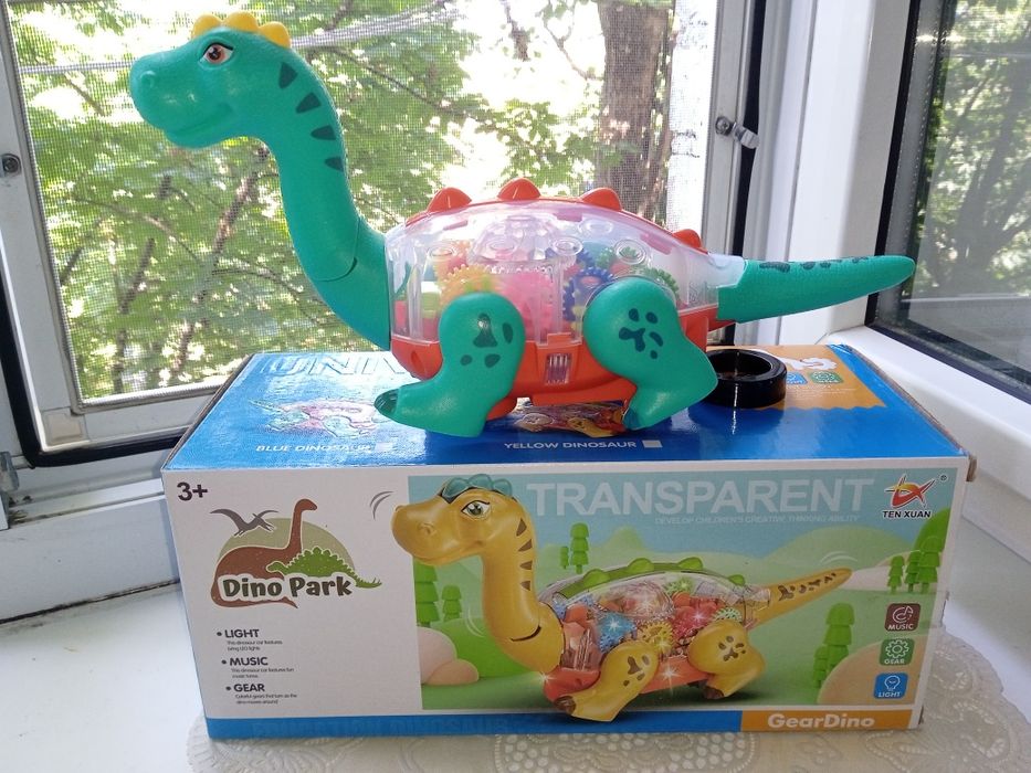 Динозавр,танцює,шестерні звук,світло 2 кольори