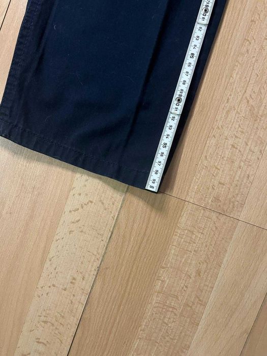 Calças azuis escuras, como novas.