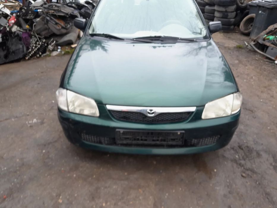 Mazda 323 323f 323  BJ 98-03  Maska lampa zderzak atrapa w kolor 18J