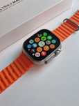 Smartwatch pomarańczowy pasek