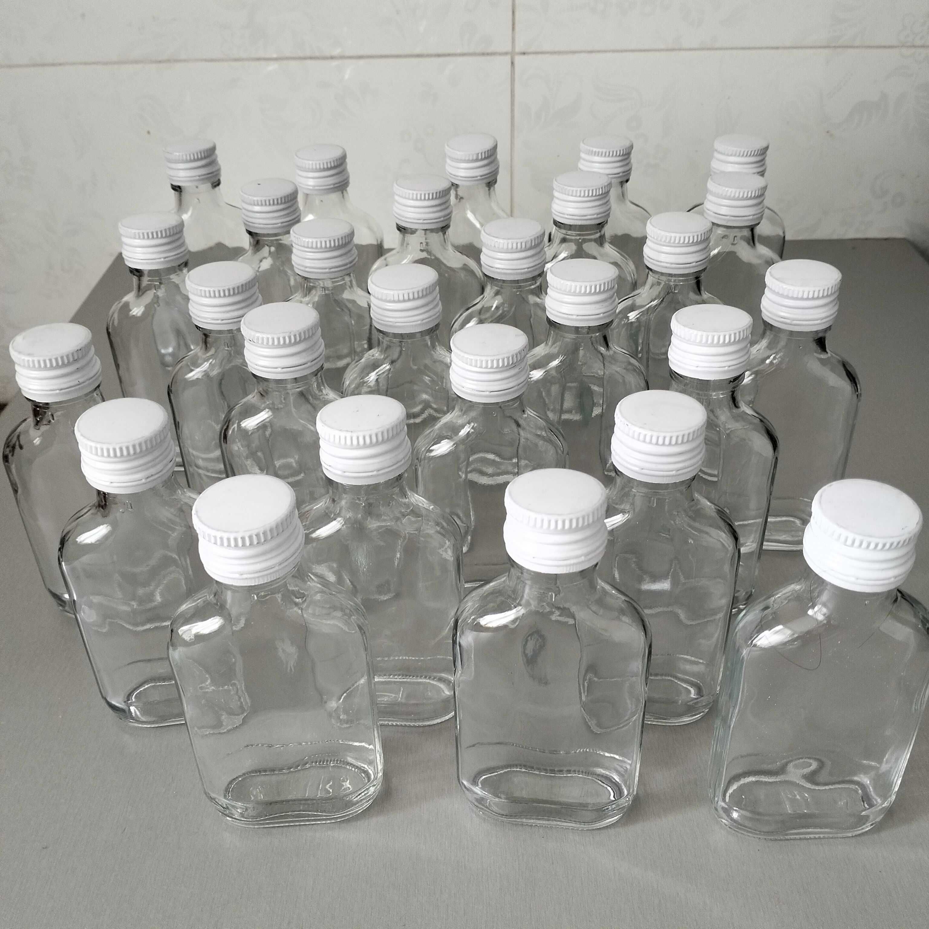 Butelki 100 ml setki 15 sztuk plus zakrętki białe.