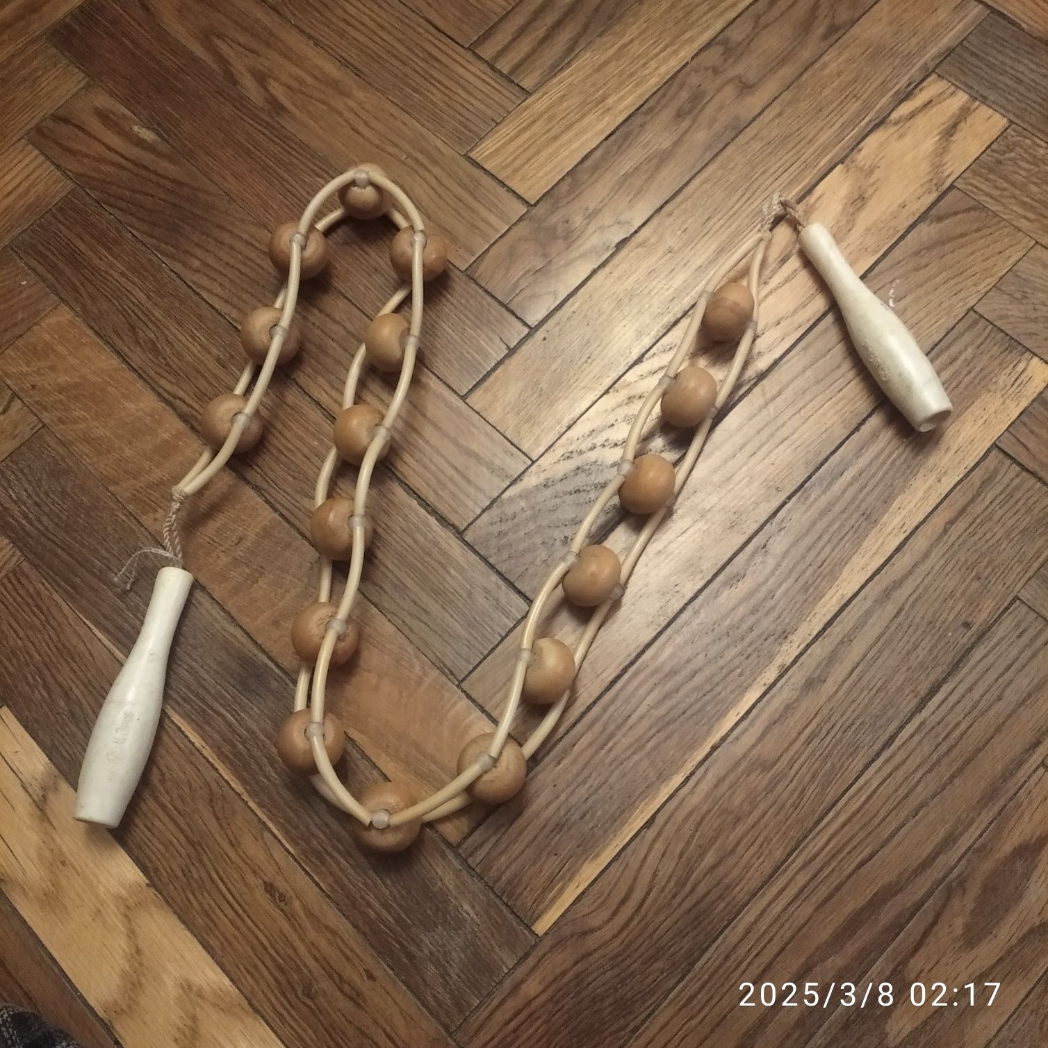 Ручний роликовий масажер.