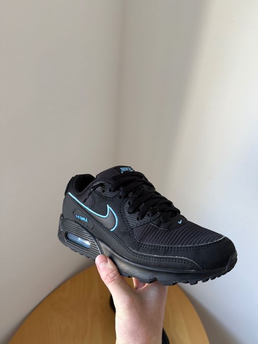 This is a pair of black Nike Air Max 90 sneakers with