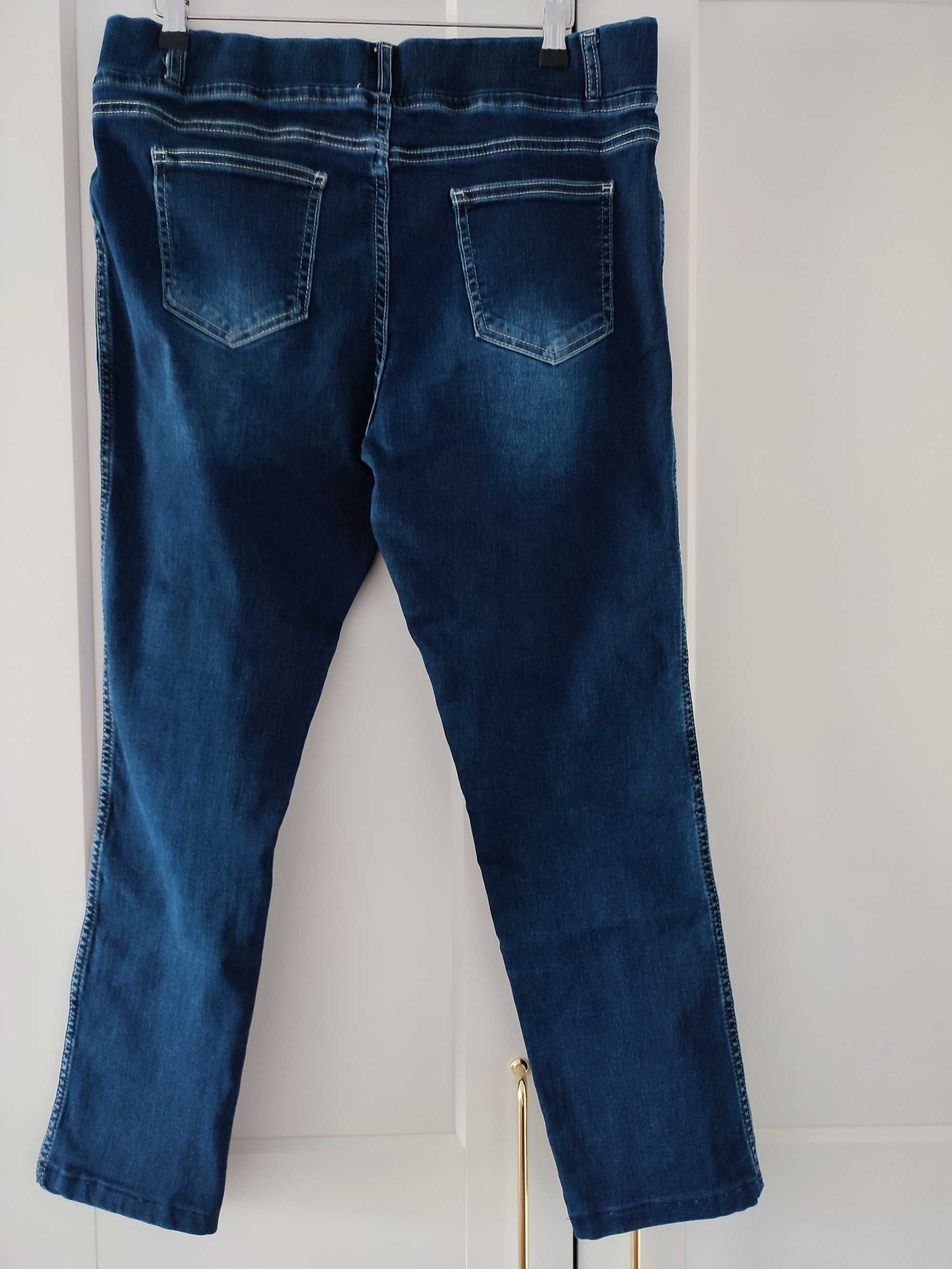 jeansowe spodnie z dziurami rozmiar 42-44