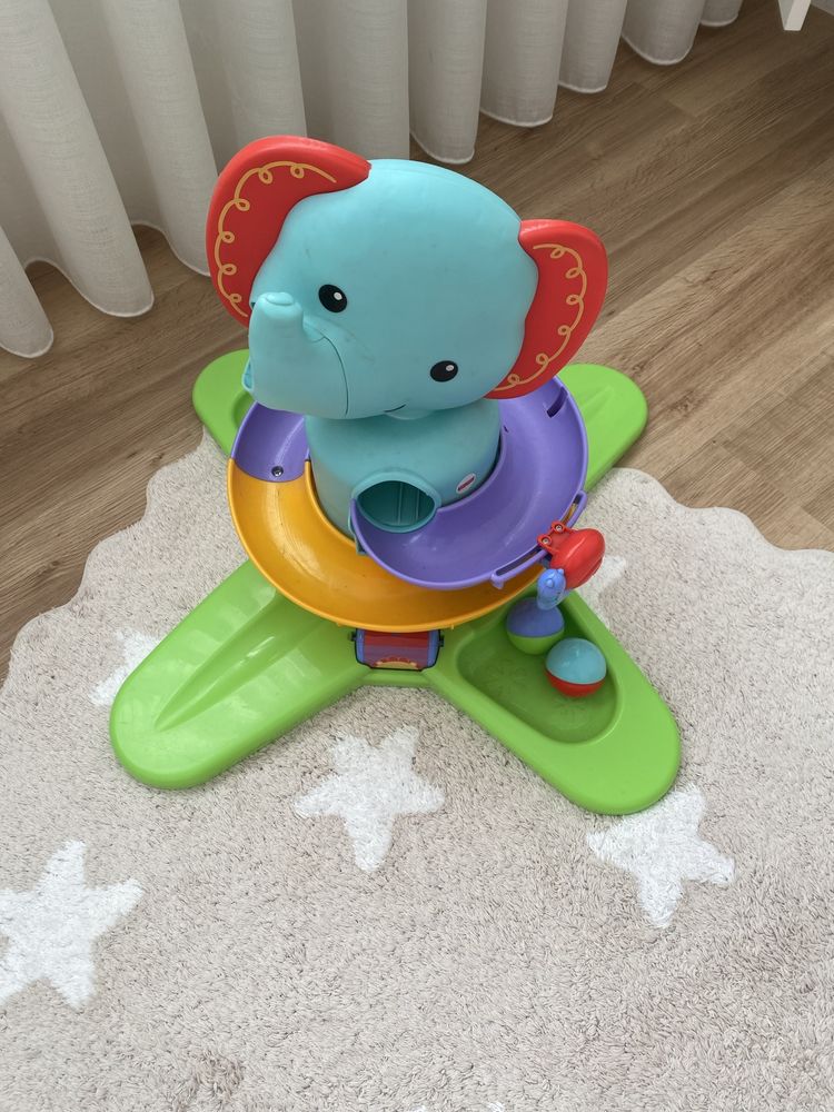 Elefante musical fisher price com duas bolas