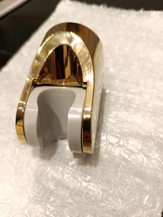 Uchwyt  prysznicowy Omnires złoty nowy.